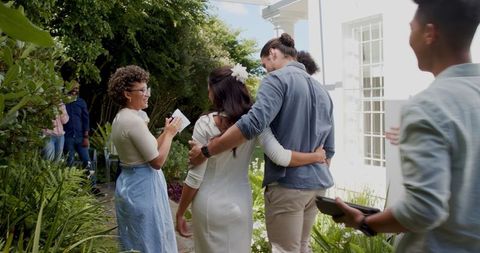 Joyful Outdoor Wedding Ceremony with Smiling Guests