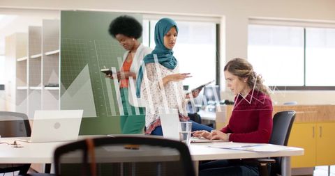 Team Collaborating on Financial Data Visualization in Office