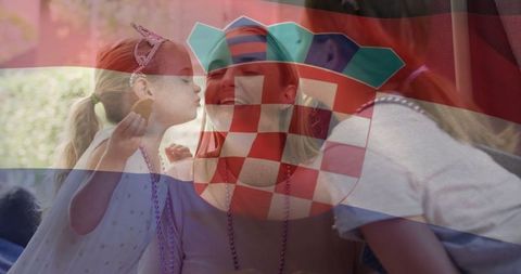 Joyful family celebration under croatian flag overlay