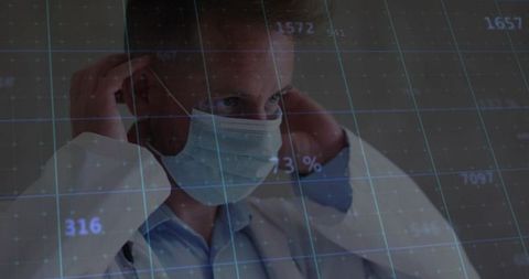 Clinician adjusting surgical mask with futuristic data grid overlay for health analytics