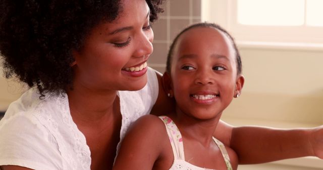 Loving Family Moment Mother and Daughter Smiling Indoors - Download Free Stock Images Pikwizard.com