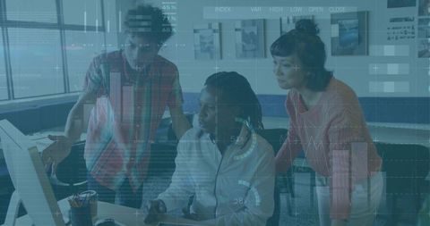 Collaborating team analyzing interactive data dashboards at modern office workstation