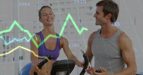 Female cardio training with personal trainer using analytics overlay in bright gym studio