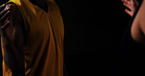 Two basketball players competing on court in dynamic action