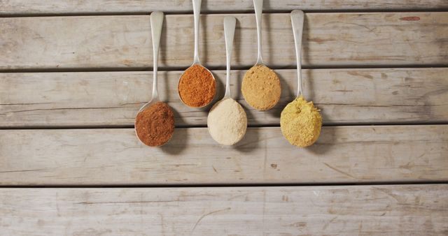 Various Spices in Spoons on Wooden Table - Download Free Stock Images Pikwizard.com