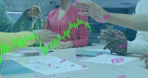 Collaborative Business Strategy Meeting with Digital Chart Overlay