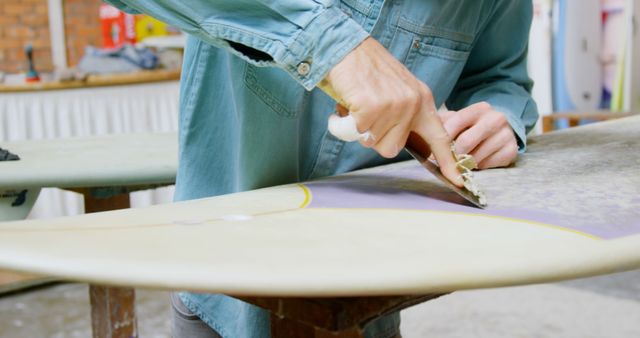 Surfboard Repair Hadle By Man in Workshop - Download Free Stock Images Pikwizard.com