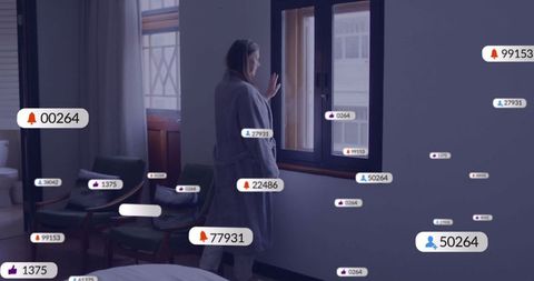 Woman reflecting by window with overlapping digital icons