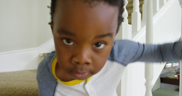 Curious Young Boy Exploring Indoors Near Staircase - Download Free Stock Images Pikwizard.com