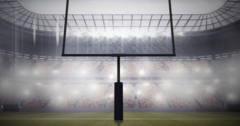 American Football Goalposts During Night Game in Stadium - Download Free Stock Images Pikwizard.com