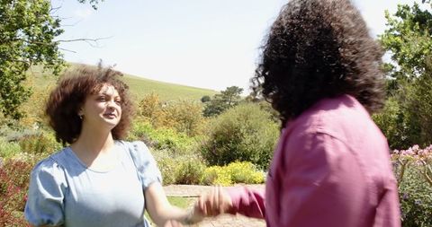 Romantic marriage proposal in lush garden setting