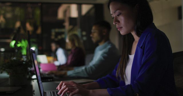 Dedicated Professionals Working Late at Night in Modern Office - Download Free Stock Images Pikwizard.com