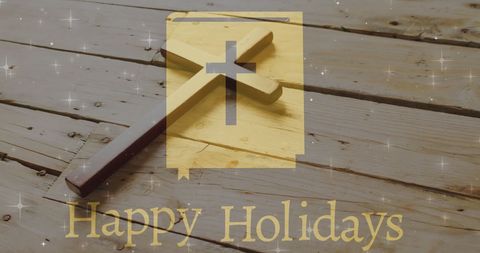 Happy holidays greeting with wooden cross background