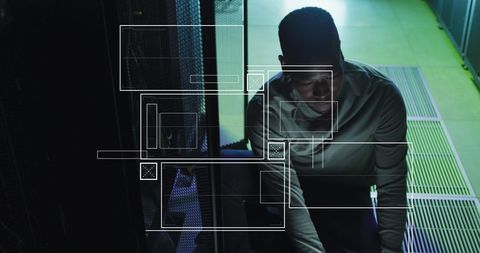 african american engineer working in server room with data interface - Download Free Stock Images Pikwizard.com