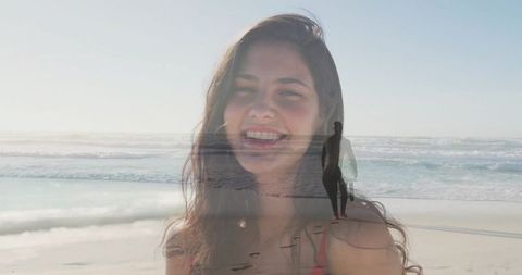 Woman Smiling by Ocean with Surfer and Beach Vibes in Background