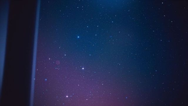 Ethereal starry night sky with soft purple blue gradient