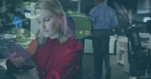 Woman Analyzing Data at Office with Digital Tablet at Night