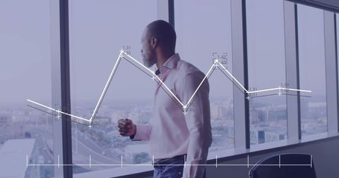 Businessman Contemplating Financial Growth in Office