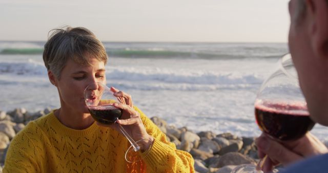 Middle-aged Couple Enjoying Wine by the Ocean During Sunset - Download Free Stock Images Pikwizard.com