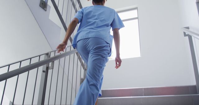 Nurse Climbing Stairs in Hospital Building - Download Free Stock Images Pikwizard.com