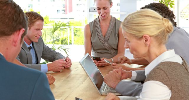 Business Team Collaborating on Project Using Technology at Office Meeting - Download Free Stock Images Pikwizard.com