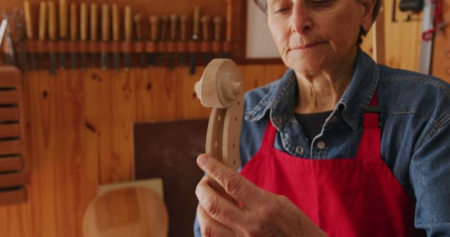 Senior Woman Inspecting Woodwork Piece in Workshop - Download Free Stock Images Pikwizard.com