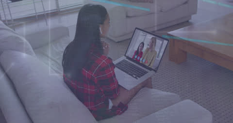 Woman Engaging in Virtual Meeting Using Laptop at Home