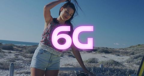 Woman Adventuring at Coastal Beach with 6G Tech Vibe