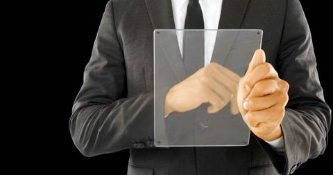 Businessman Using Futuristic Glass Tablet Technology - Download Free Stock Images Pikwizard.com
