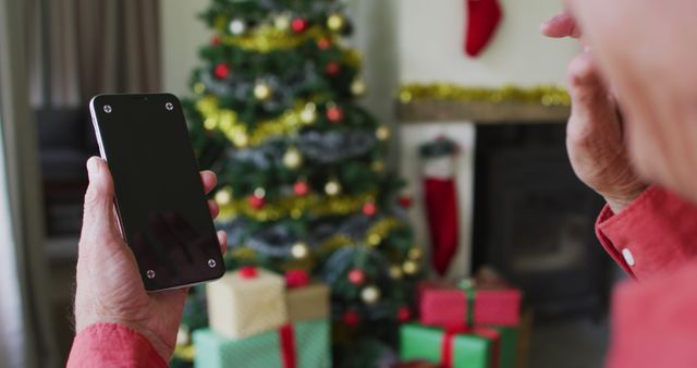 Elderly Man Video Calling Family During Christmas Celebration at Home - Download Free Stock Images Pikwizard.com