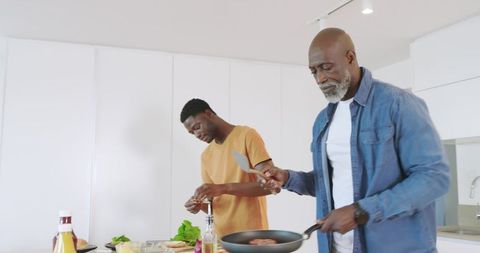 Father and Son Bonding Over Cooking in Modern Kitchen