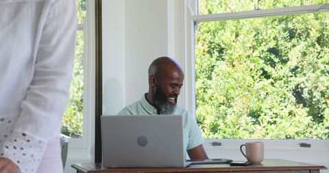 Senior couple enjoying wedding planning at cozy home