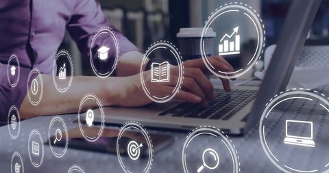 Man analyzing business data on laptop with virtual icons overlay