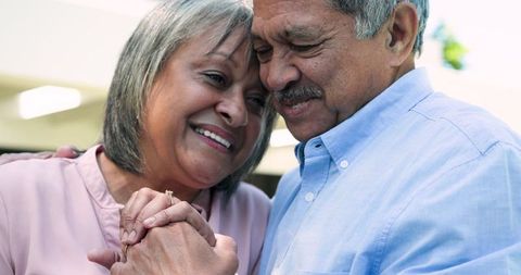 Senior Couple Celebrating Engagement in Sunny Outdoor Setting