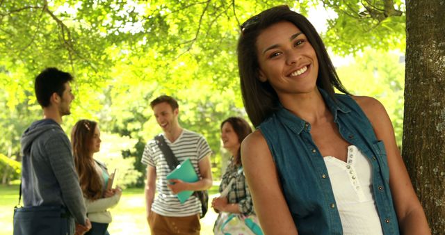 Happy College Student Posing Outdoors with Friends - Download Free Stock Images Pikwizard.com