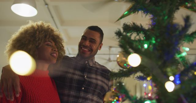 Smiling Couple Decorating Christmas Tree Together at Home - Download Free Stock Images Pikwizard.com