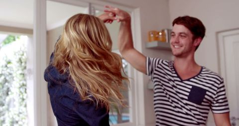 Playful Moment Between Friends in Bright Home Setting