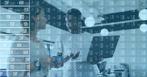Businesswomen reviewing flight plan in aviation hangar