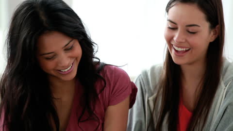 Smiling Friends Enjoying Tablet at Home
