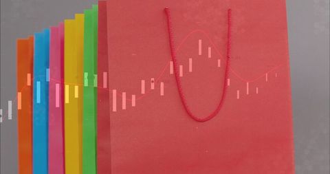 Red shopping bag with braided handle and financial chart overlay, colorful paper bags