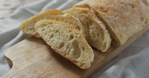 Slices of Fresh Homemade Bread on Wooden Board