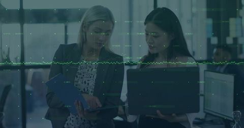 Professional businesswomen analyzing data in modern office