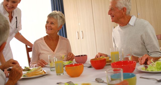 Senior Adults Enjoying Meal Together at Retirement Home - Download Free Stock Images Pikwizard.com