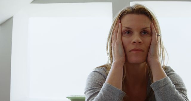 Stressed Woman Contemplating in Modern Home Interior - Download Free Stock Images Pikwizard.com