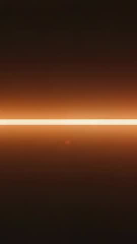 Looping Vertical LED Bar Pulsing Amber Glow with Red Flare Minimal Dark Abstract Motion