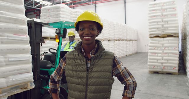 Confident Warehouse Worker Standing Near Forklift - Download Free Stock Images Pikwizard.com