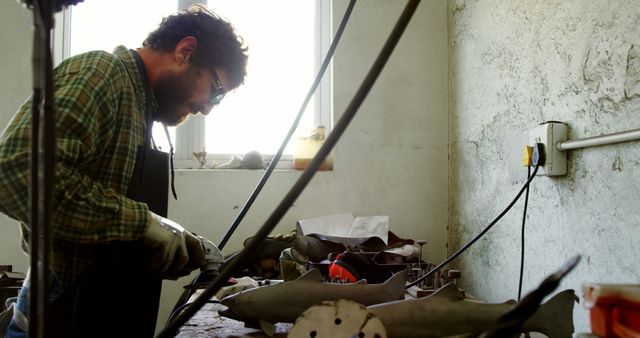 Artisan Sculptor Working on Metal Shark Project in Workshop - Download Free Stock Images Pikwizard.com