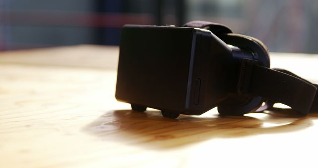 Virtual Reality Headset on Wooden Table in Sunlight - Download Free Stock Photos Pikwizard.com
