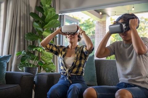 Diverse Family Enjoying Virtual Reality Technology at Home
