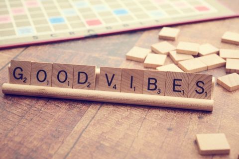 Inspirational message with scrabble tiles on wooden surface